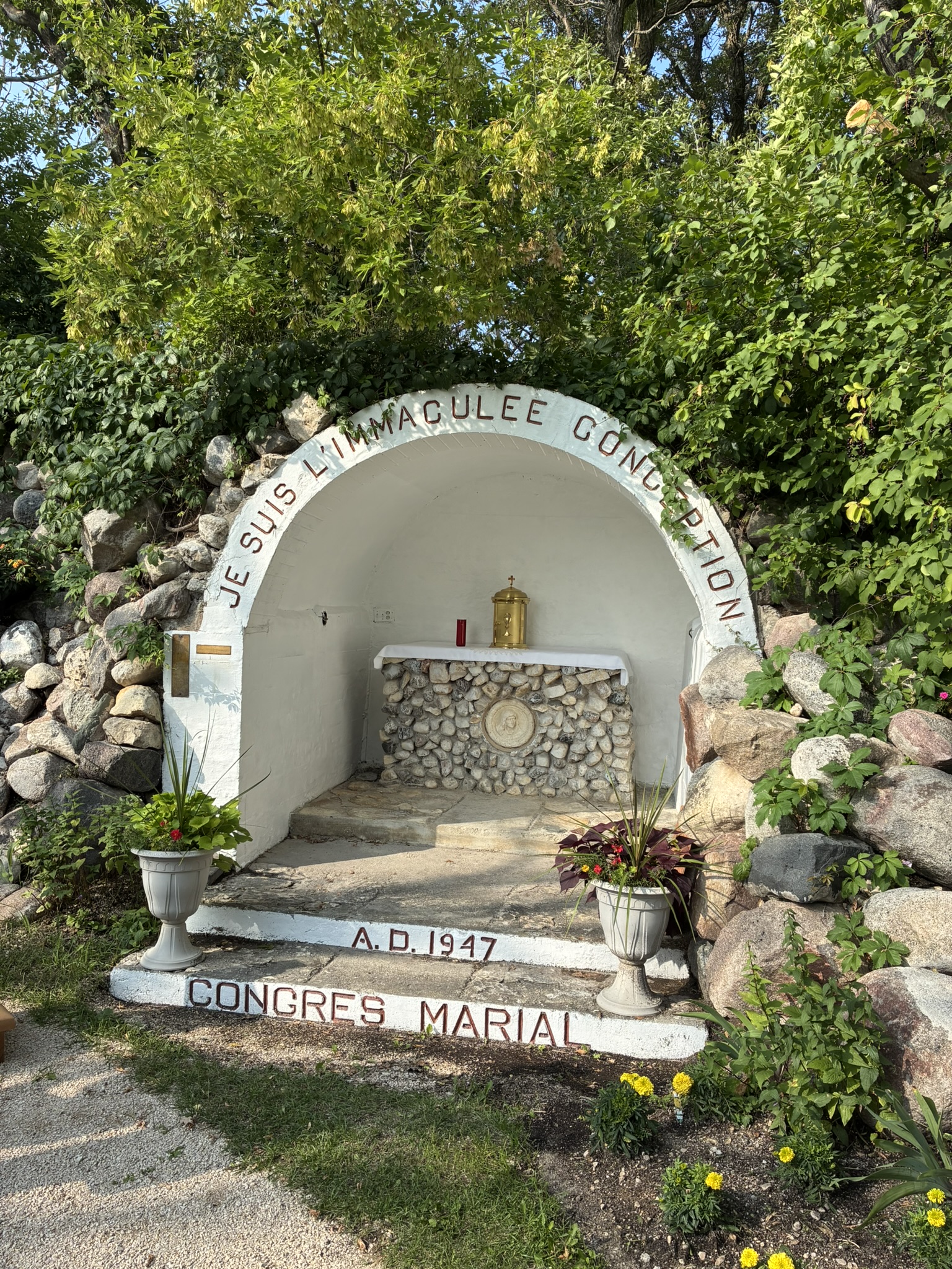 Historic 1947 outdoor grotto shrine reflecting Minto's deep Christian heritage